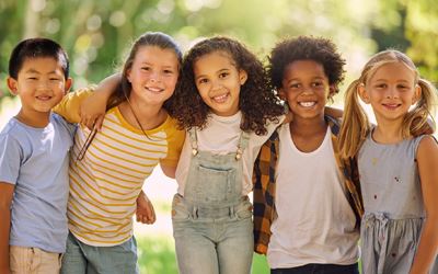 group of young children hugging links to City of Parkland Youth and Camp Programs webpage