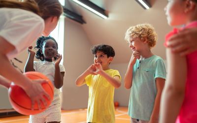 young children at basketball camp links to Specialty Camp Programs webpage